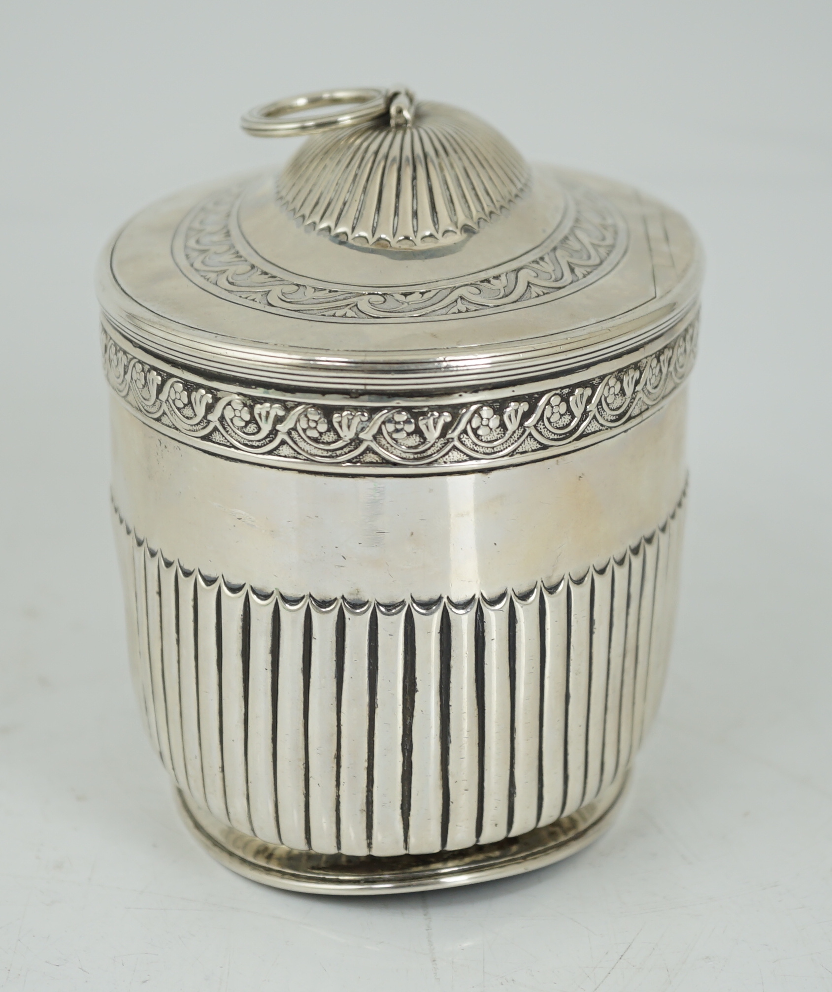 A George III demi fluted silver oval tea caddy by Andrew Fogelberg & Stephen Gilbert